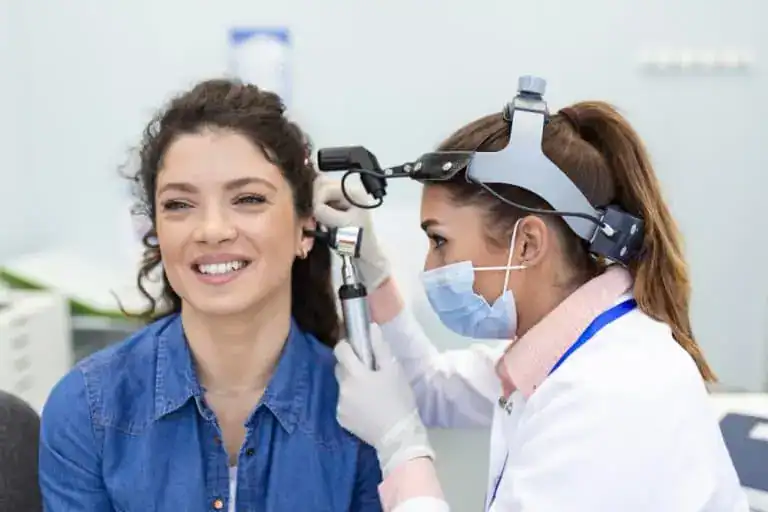 otoscopic examination by clinician